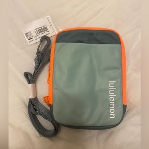 Army green and neon orange Lululemon crossbody bag